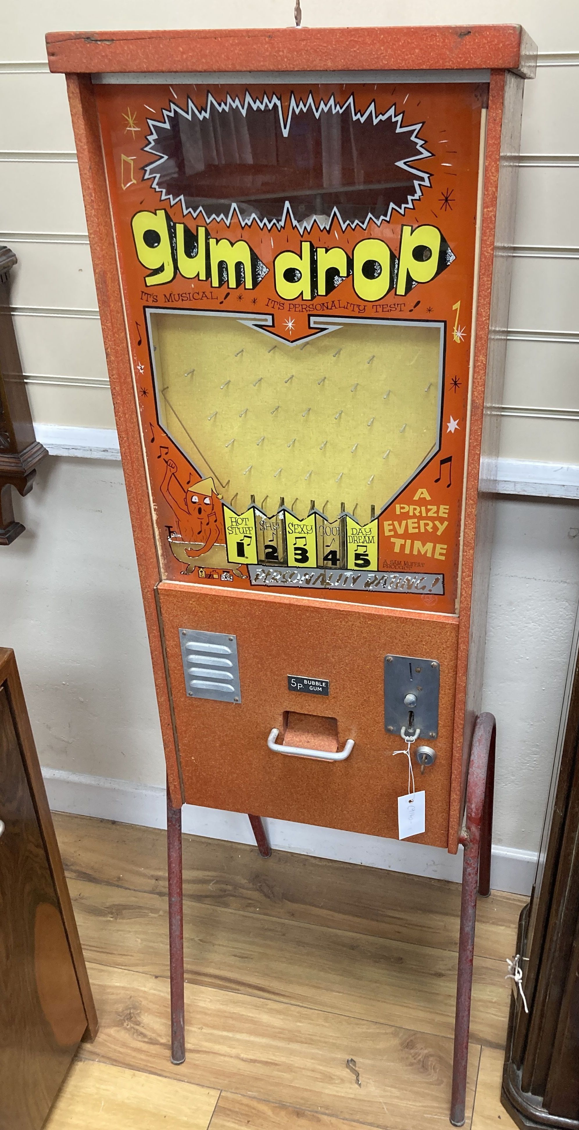 A novelty 20th century gum drop musical personality test arcade machine, width 38cm, depth 28cm, height 137cm